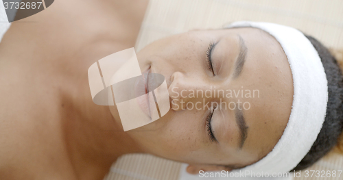 Image of Naked Woman Lying On A Massage Table