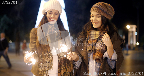 Image of Attractive young women having fun at Christmas