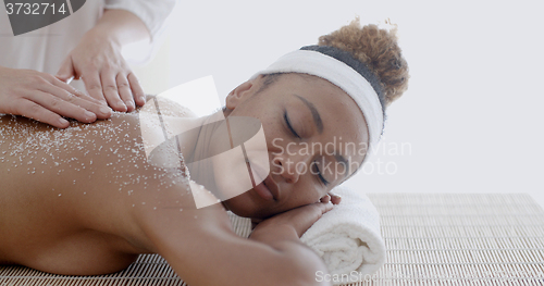 Image of Female Getting A Salt Scrub Treatment