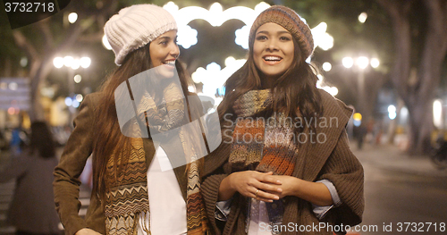 Image of Two young woman enjoying a winter night out