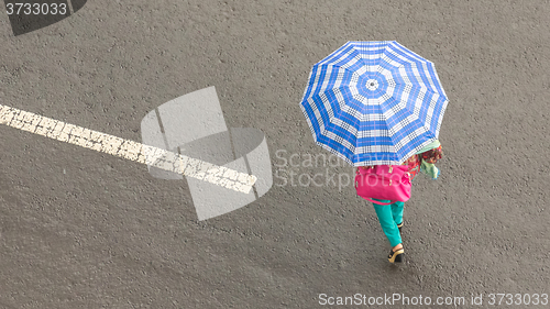 Image of Woman holding an umbrella