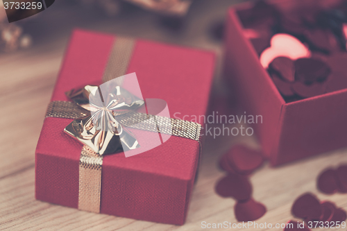 Image of Red hearts confetti on wooden background