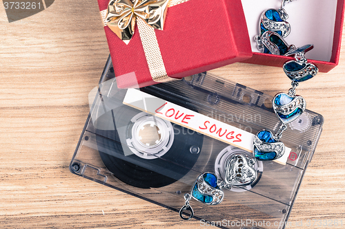 Image of Audio cassette tape and bracelet