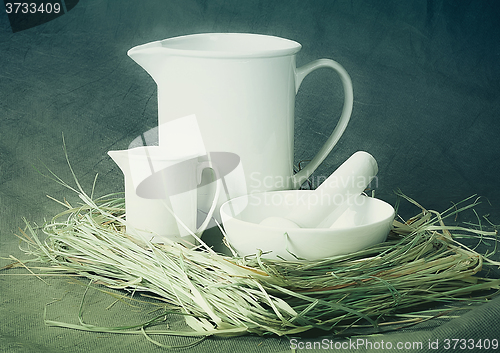 Image of White porcelain set on a gray background