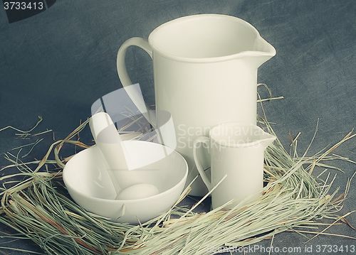 Image of White porcelain set on a gray background