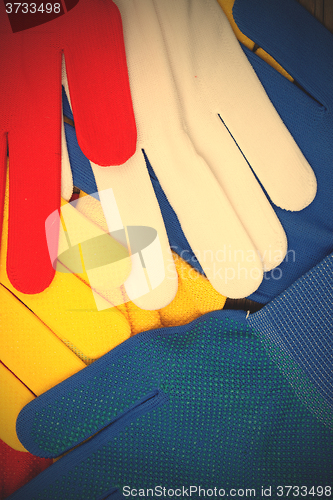 Image of colored work gloves on the display