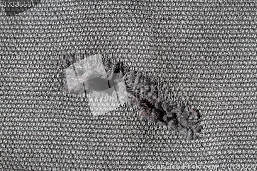 Image of Hole in Textile
