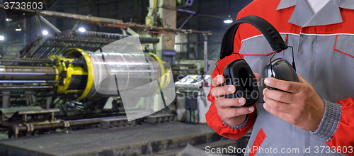 Image of Worker with protective headphone