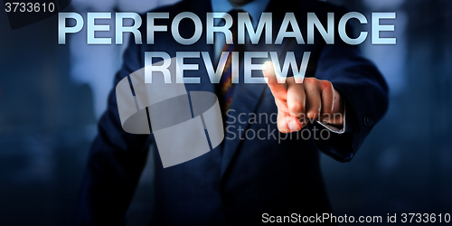 Image of Manager Touching PERFORMANCE REVIEW Onscreen