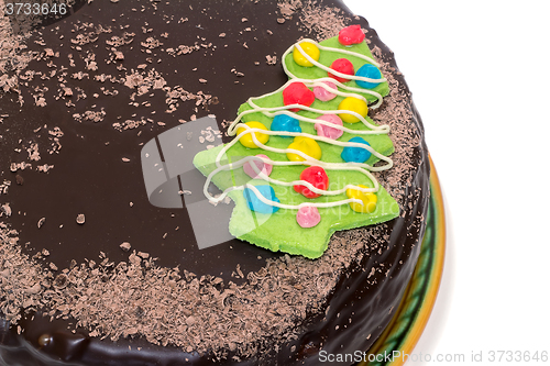 Image of Chocolate cake on a ceramic dish on white background.