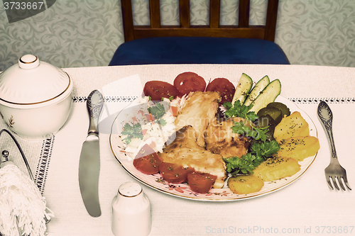 Image of Baked fish and vegetables . The view from the top.
