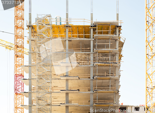 Image of construction site, building and cranes