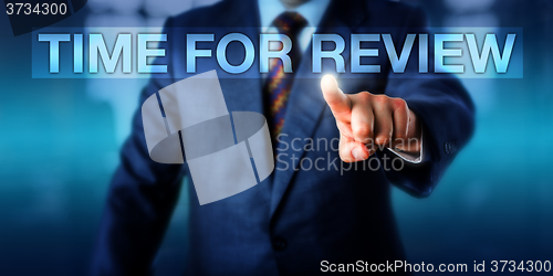 Image of HR Manager Pressing TIME FOR REVIEW