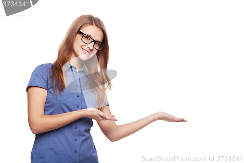 Image of Smiling business woman showing open hand palm