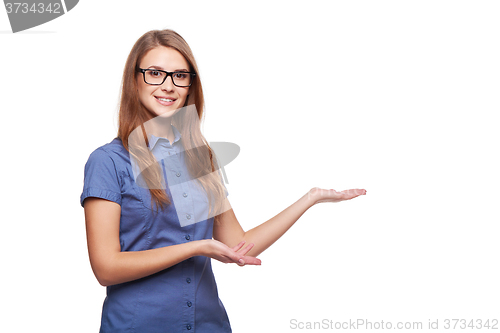 Image of Smiling business woman showing open hand palm