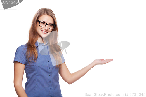 Image of Smiling business woman showing open hand palm