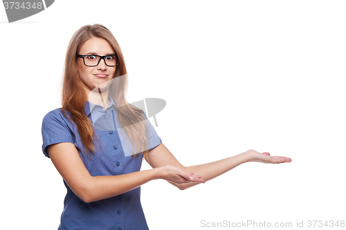 Image of Smiling business woman showing open hand palm