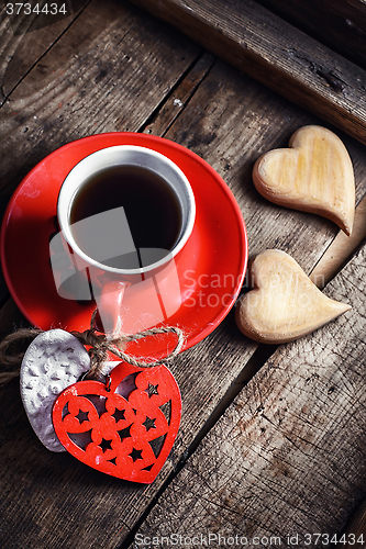 Image of Cup with wooden hearts