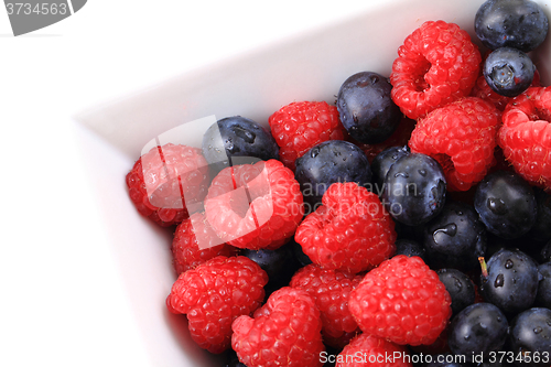 Image of raspberries and blueberries background