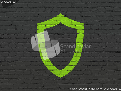 Image of Protection concept: Contoured Shield on wall background