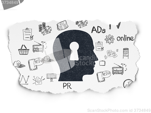 Image of Advertising concept: Head With Keyhole on Torn Paper background