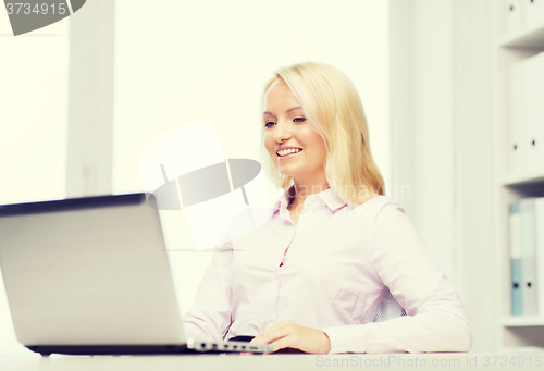 Image of smiling businesswoman or student with laptop