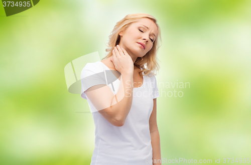 Image of unhappy woman suffering from neck pain