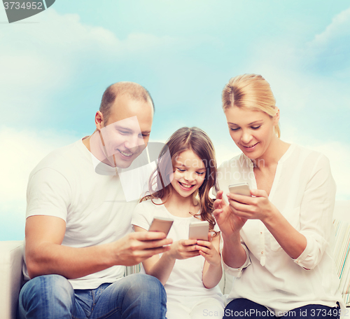 Image of happy family with smartphones