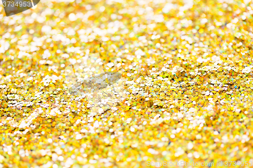 Image of golden glitter or yellow sequins background