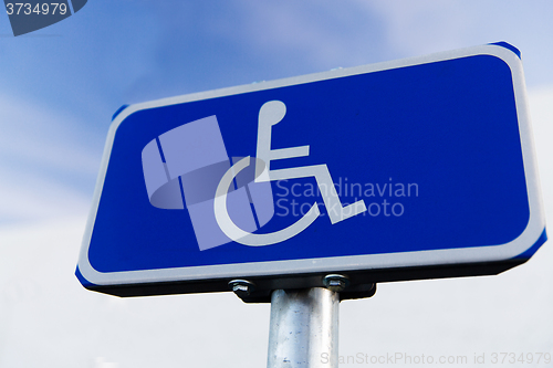 Image of close up of road sign for disabled outdoors