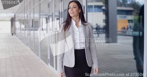 Image of Gorgeous business woman walking