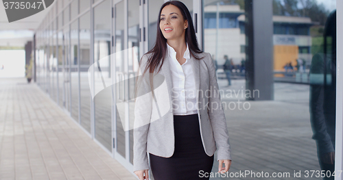 Image of Gorgeous business woman walking