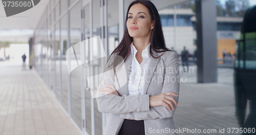 Image of Confident business woman with folded arms