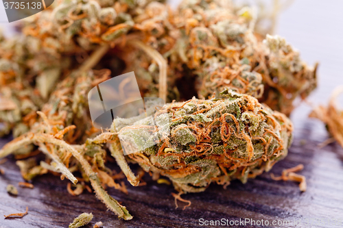 Image of Close up Dried Marijuana Leaves on the Table