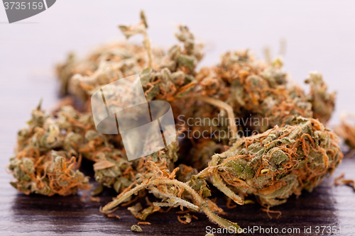 Image of Close up Dried Marijuana Leaves on the Table