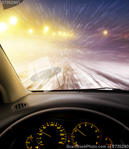 Image of snow-covered road at night