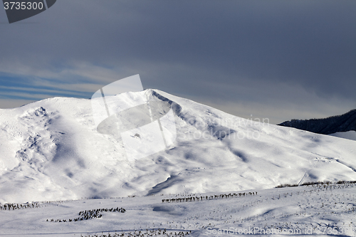 Image of Snowy mountains at sun morning