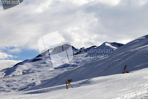 Image of Ski slope with snowmaking at evening