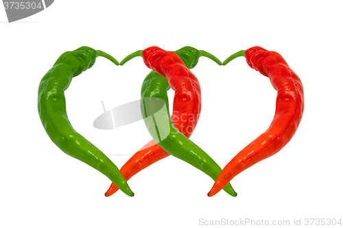 Image of Red and green chili peppers in love. Hearts composed of hot pepp