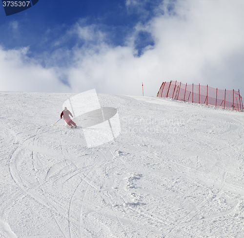 Image of Skier on ski slope at nice sun day