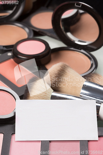 Image of makeup cosmetics for eyes and bussiness card