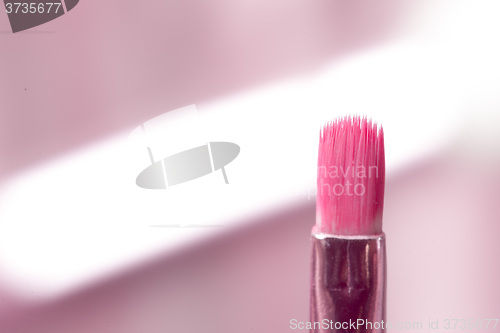 Image of close-up pink professional cosmetic brush 