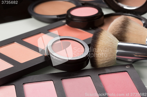 Image of makeup cosmetics. compact powder, mineral foundation and makeup brushes