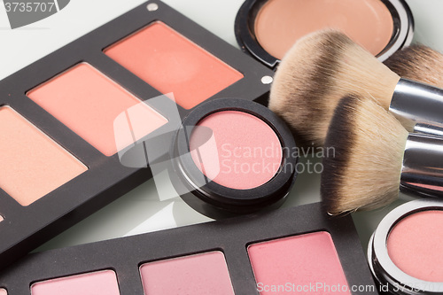 Image of makeup cosmetics. compact powder, mineral foundation and makeup brushes