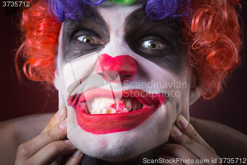 Image of Evil Spooky Clown Portrait on dark background. expressive man