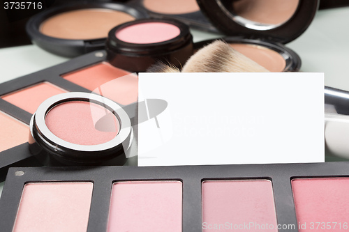 Image of makeup cosmetics for eyes and bussiness card
