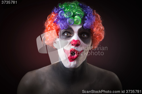 Image of Evil Spooky Clown Portrait on dark background. expressive man