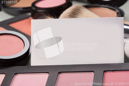 Image of makeup cosmetics for eyes and bussiness card