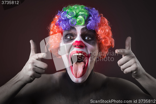 Image of Evil Spooky Clown Portrait on dark background. expressive man