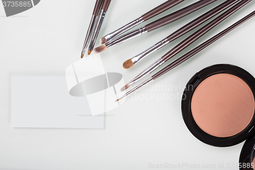 Image of makeup cosmetics for eyes and bussiness card